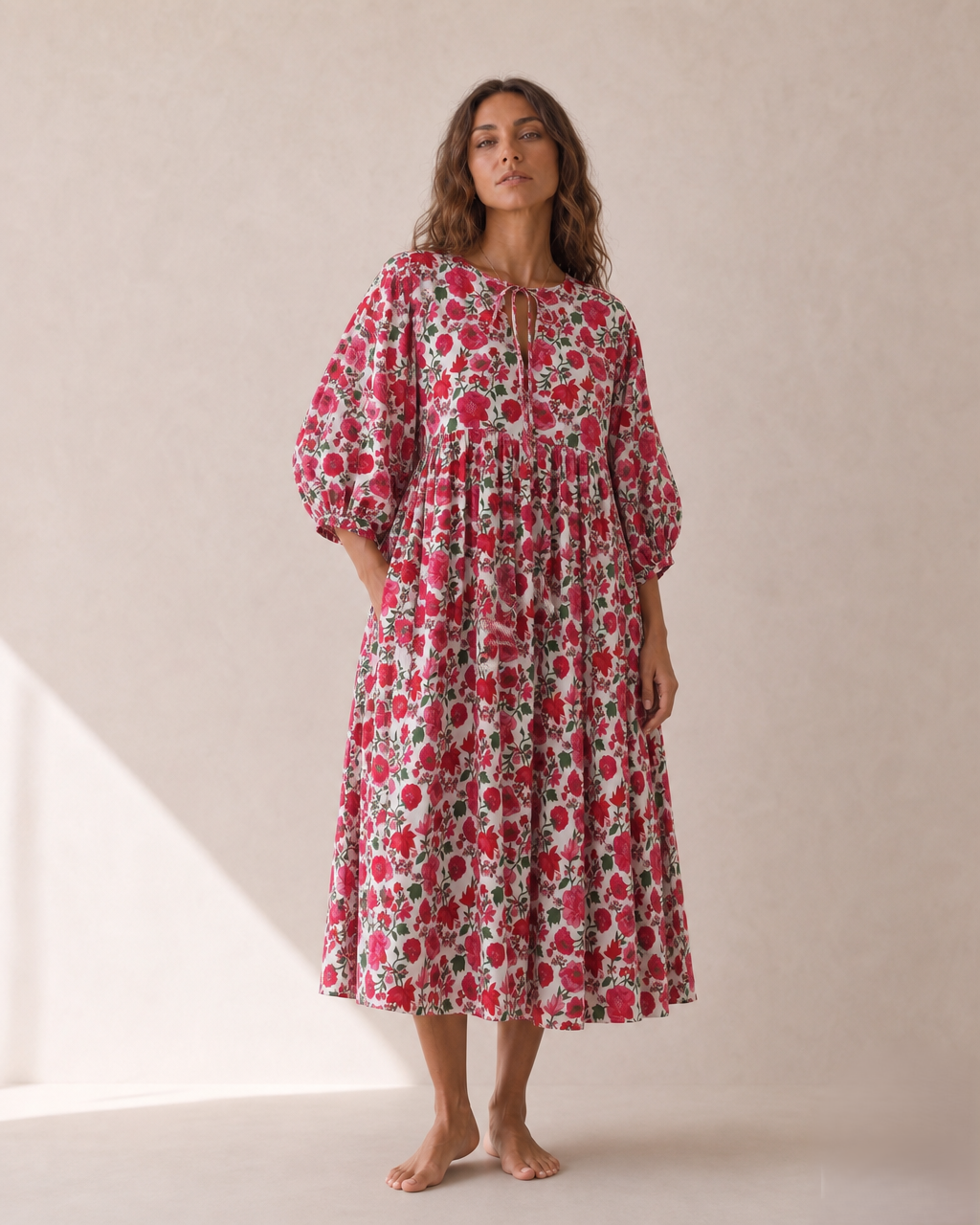 Rosette Bloom Midi Dress — red floral dress, full-length front view with hand on hip