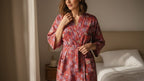 Woman wearing a patterned robe in a bedroom setting