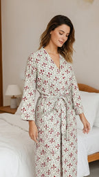 Woman wearing a floral robe in a bedroom setting